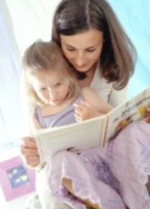 Nanny reading to child