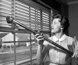 Historical domestic housemaid cleaning inside a private home